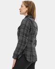 Woman wearing a gray plaid shirt on a white background