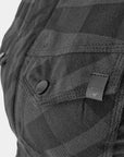 Close-up of a dark camouflage backpack with a brand logo on a light gray background