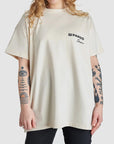 a woman wearing beige mc t-shirt from Pando Moto