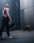 young woman motorcyclists in black red leather jacket