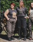 three women of difference sizes demonstrating the motorcycle cargo pants in different colous