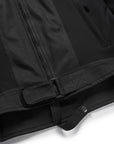 Close-up of a black coat with a belt on a white background