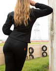 blond woman wearing a black jacket and black mc leggings from moto girl