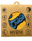 Moto Girl product packaging with a yellow and blue design on a brown cardboard background