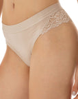 women wearing nude-colored brazilian brief with lace flounce details on the sides from Tramonte.