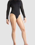 a woman is wearing black motorcycle body suit from Pando Moto