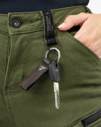 key hanging on a belt loop of khaki green lady motorcycle jeans