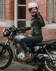 A woman on her motorcycle wearing brown leather mc shoes