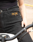 a close up of women's waist and jeans pocket with MotoGirl logo