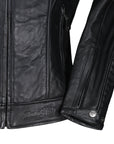 close-up sleeve of black leather jacket Valerie with moto girl logo