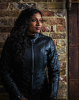 black haired woman wearing black leather jacket from moto girl