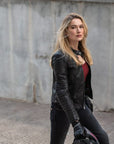 A blond woman wearing Black leather motorcycle jacket for women from Shima
