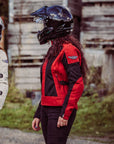 Two women with helmets on wearing red and white women's motorcycle summer jackets from Moto Girl