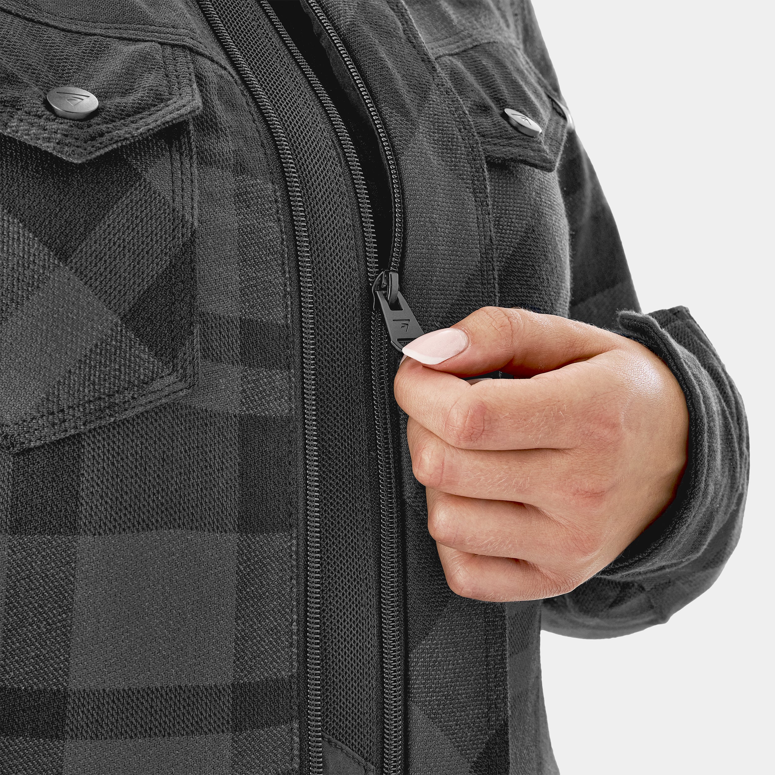 Person wearing a gray checkered jacket with a hand on the zipper