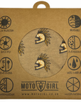 Astec bandana in sand color, featuring a pattern of yellow motorcycle helmets with feather-like details flowing down the sides, displayed in its packaging that highlights its different functions, with the MotoGirl logo at the bottom.