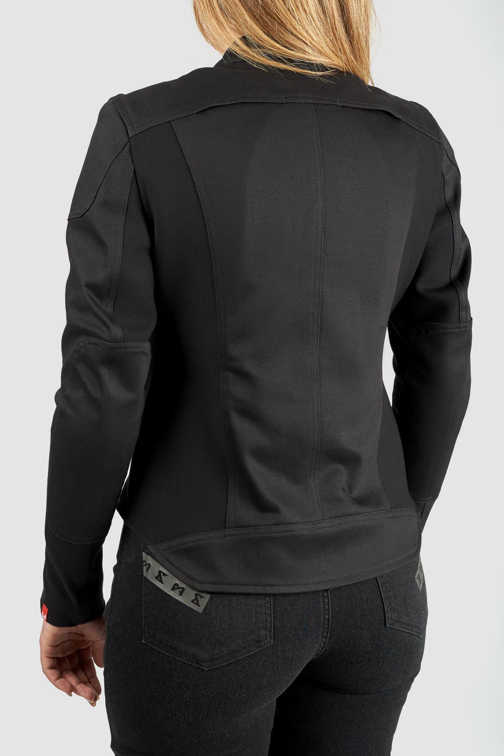 Black jacket worn by a person on a white background