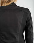 Black jacket worn by a person on a white background