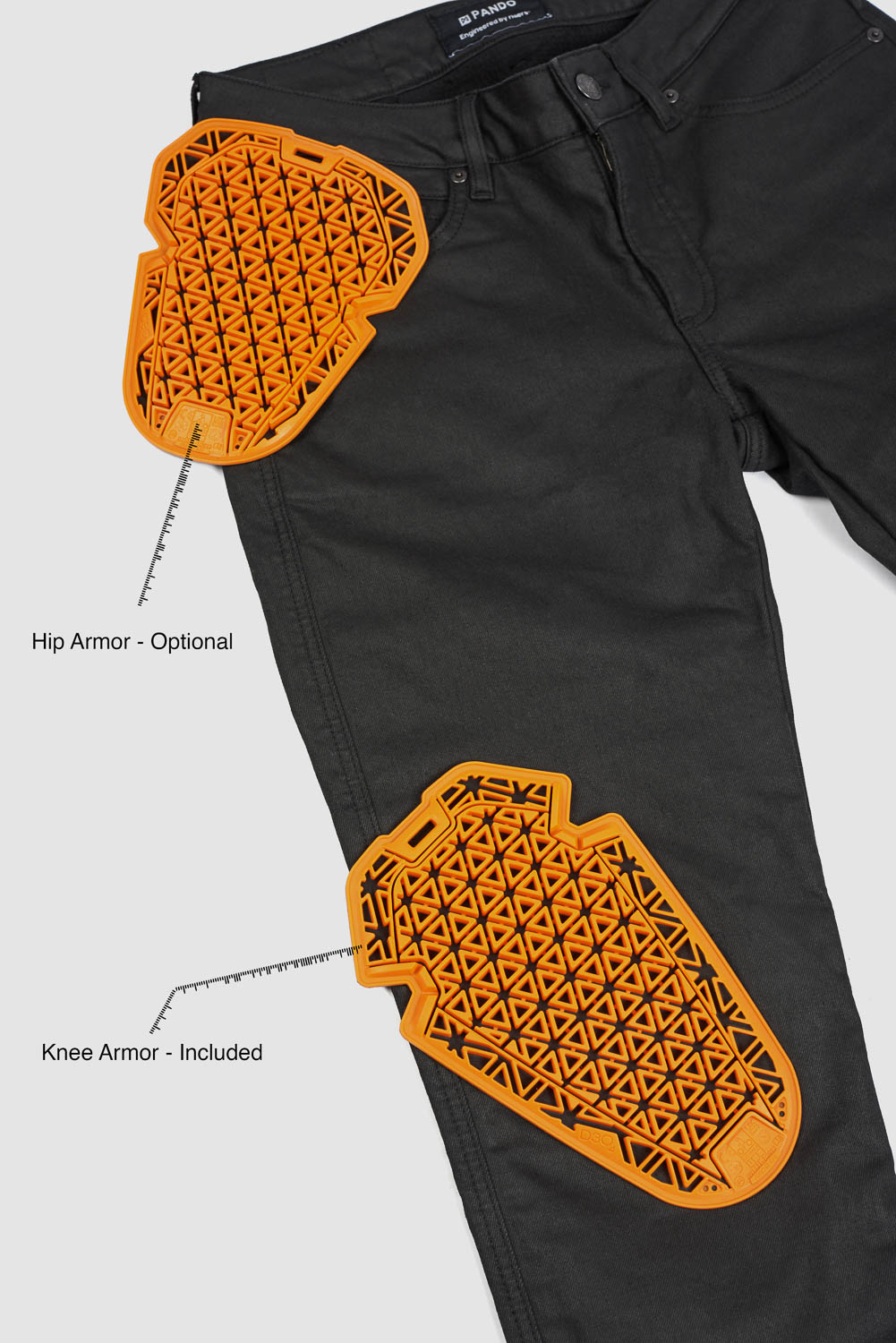 Black motorcyle pants with orange knee and hip armor on a white background