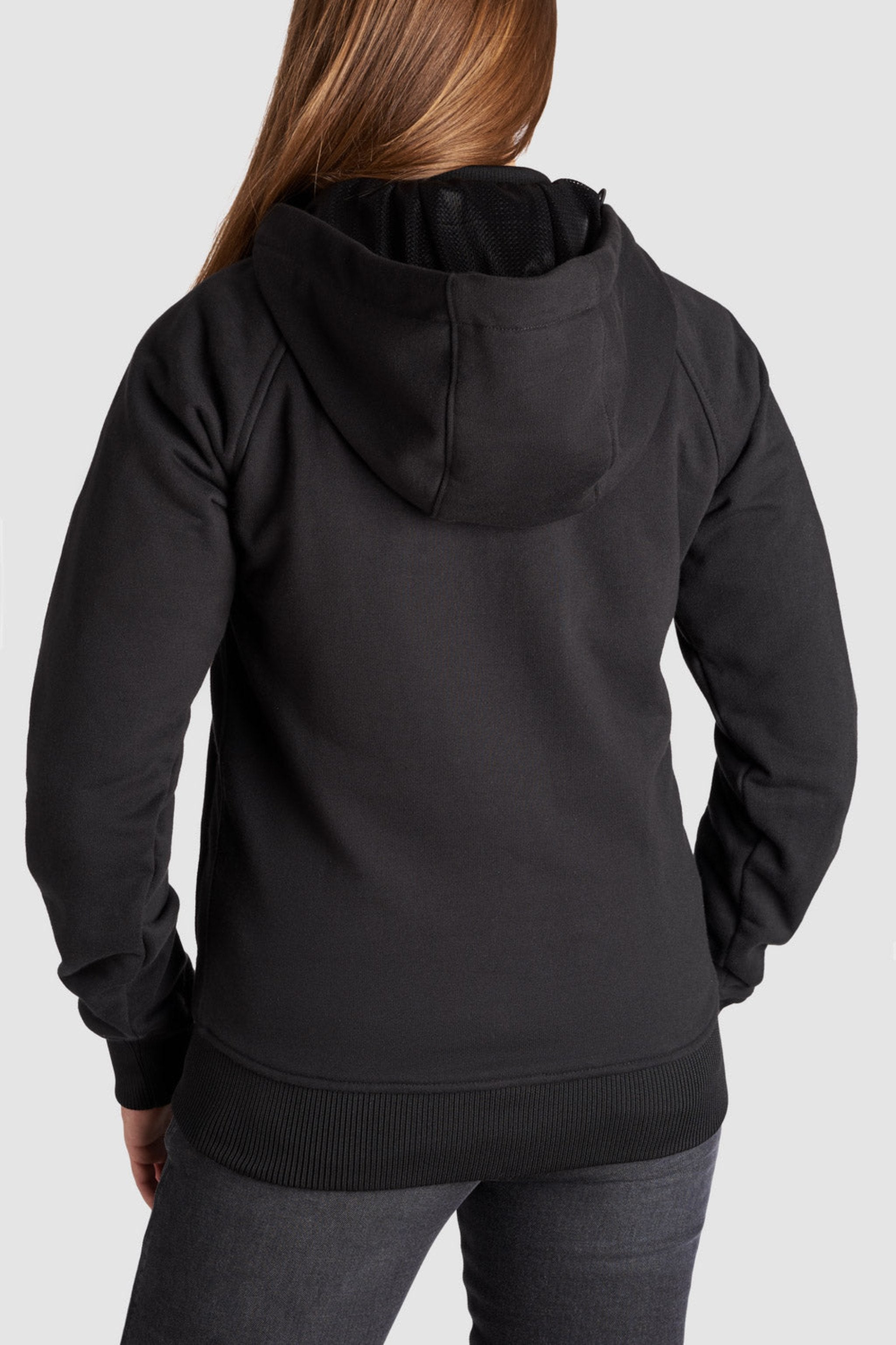 Woman standing with her back showing, wearing a Black Motorcycle Hoodie from Pando Moto 