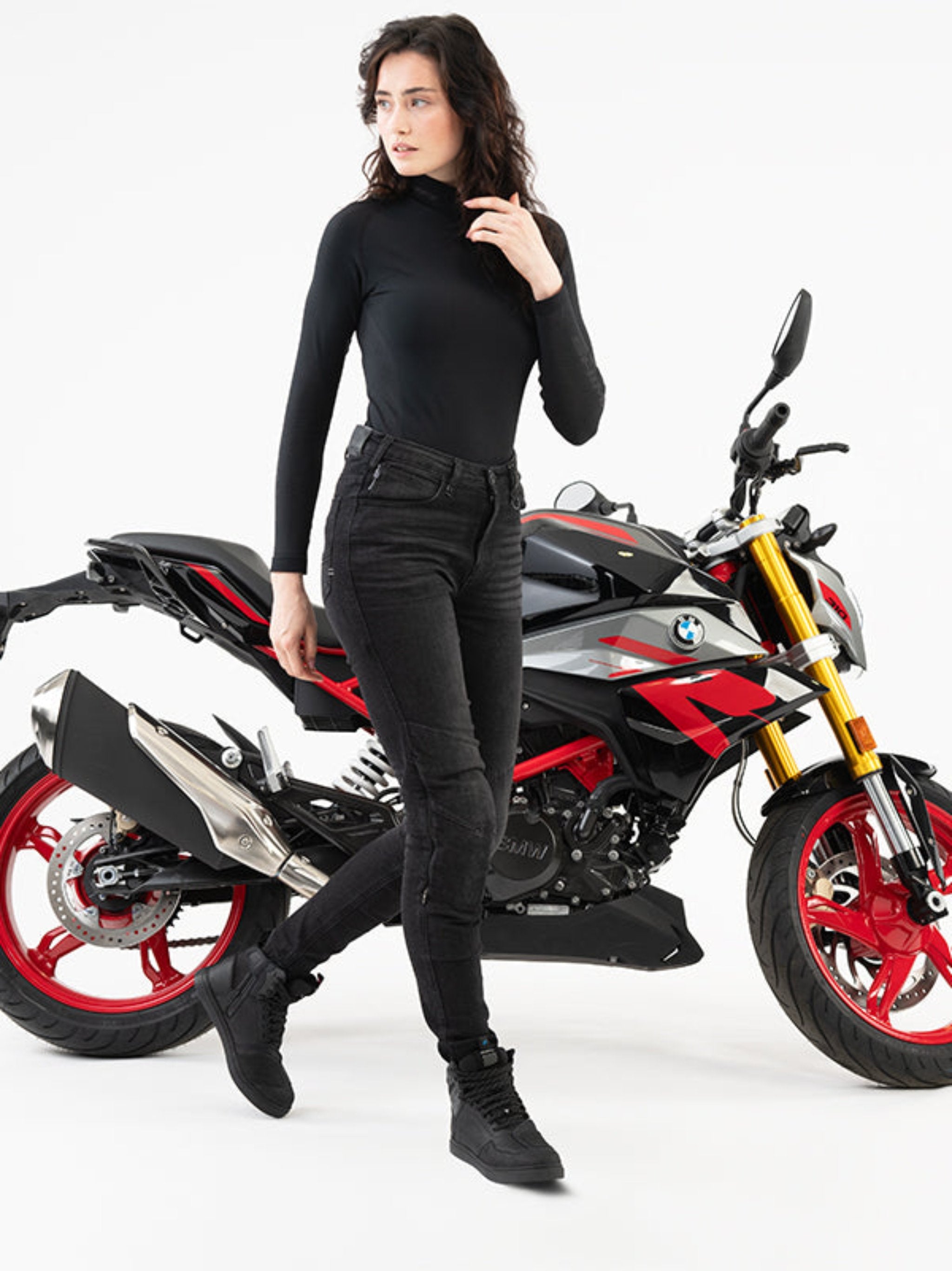 Women starting in front of motorcycle  wearing Rebel waterproof motorcycle sneakers from Shima 