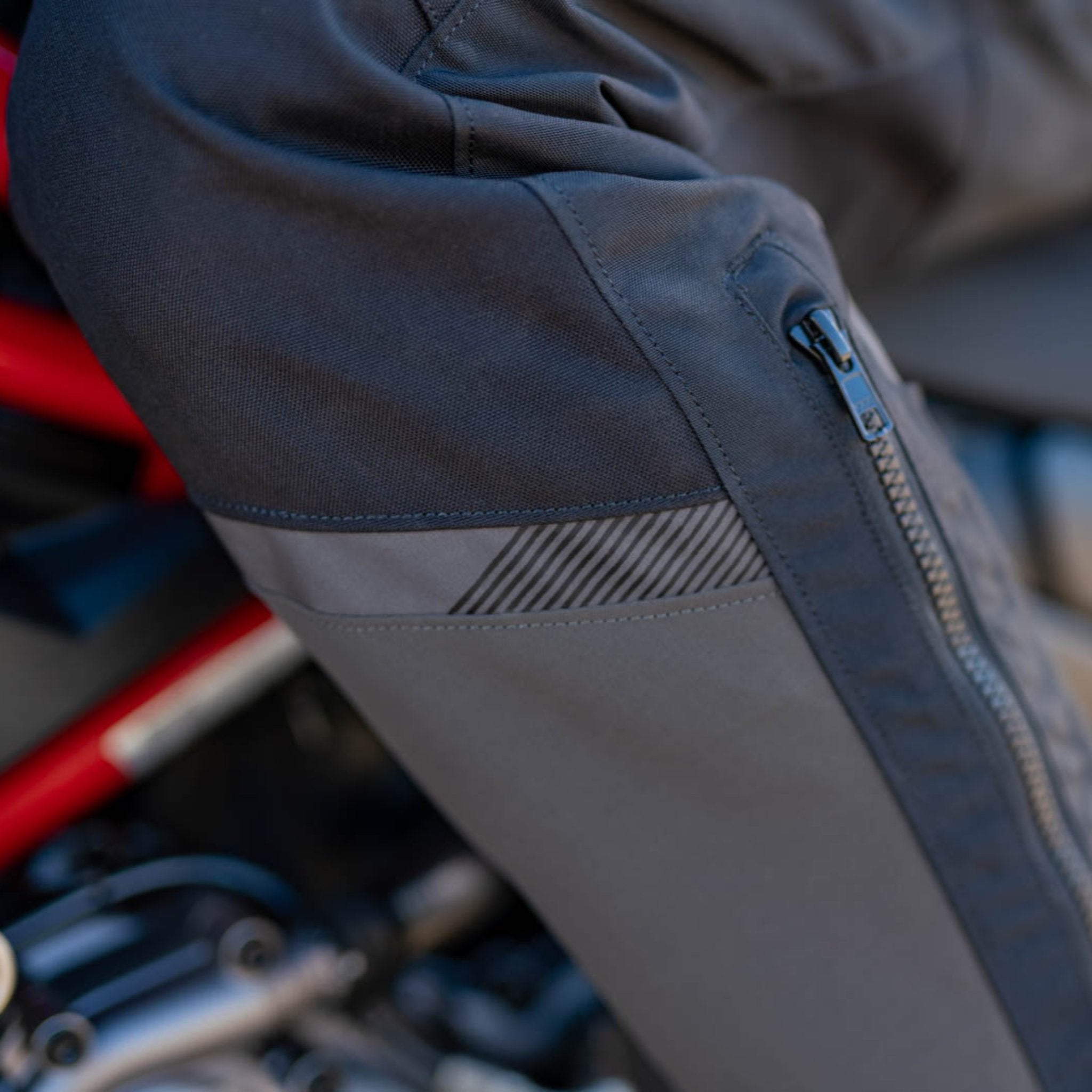 A close up of leg zipper on the women motorcycle touring pants