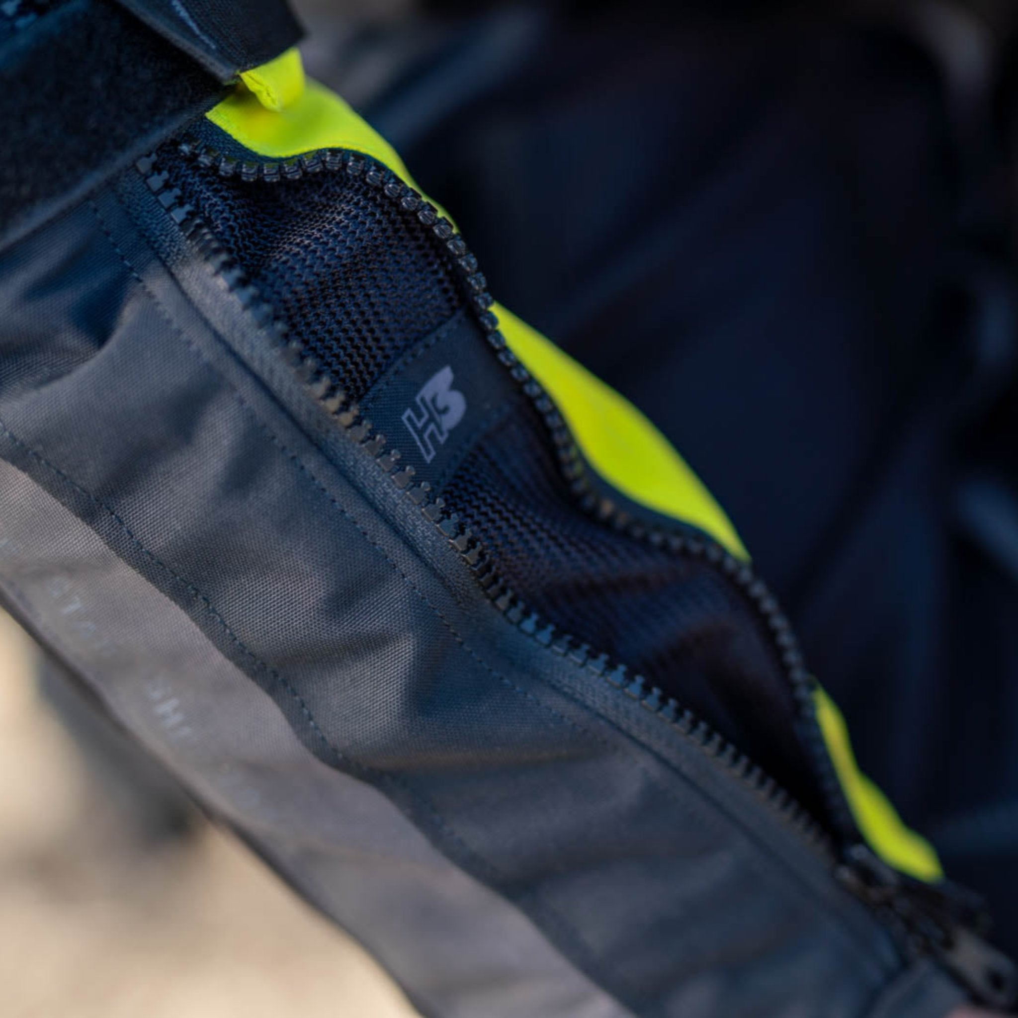 A close up of the sleeve zip on the shima motorcycle touring jacket for women in black/ fluo