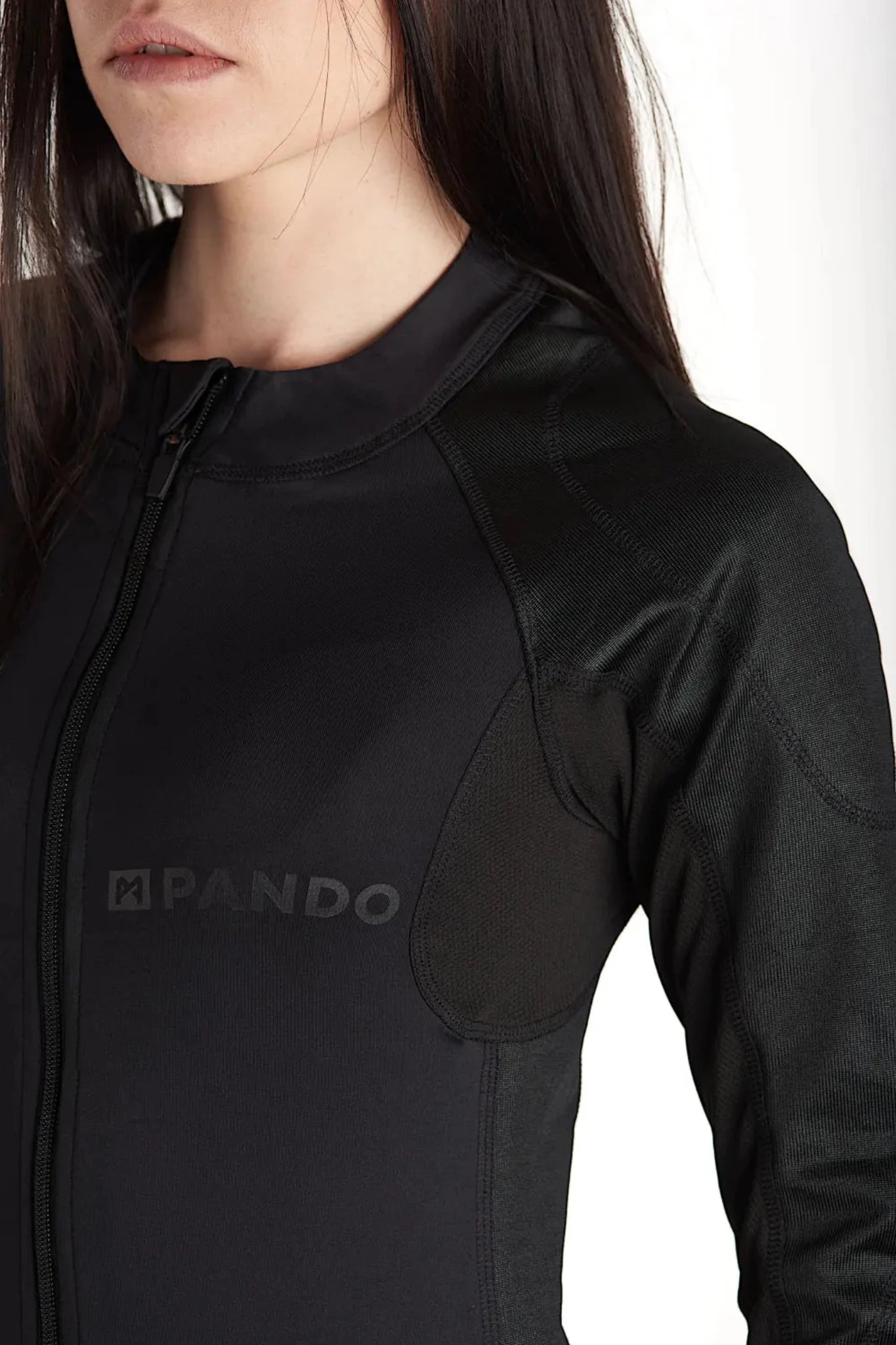 close up of a woman wearing black tight motorcycle underwear with Pando Moto Logo