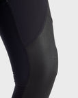 A close up of the knee  wearing Pando Moto SKIN AAA armoured base layer leggings in black