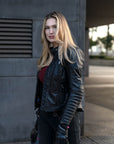 A blond woman wearing Black leather motorcycle jacket for women from Shima