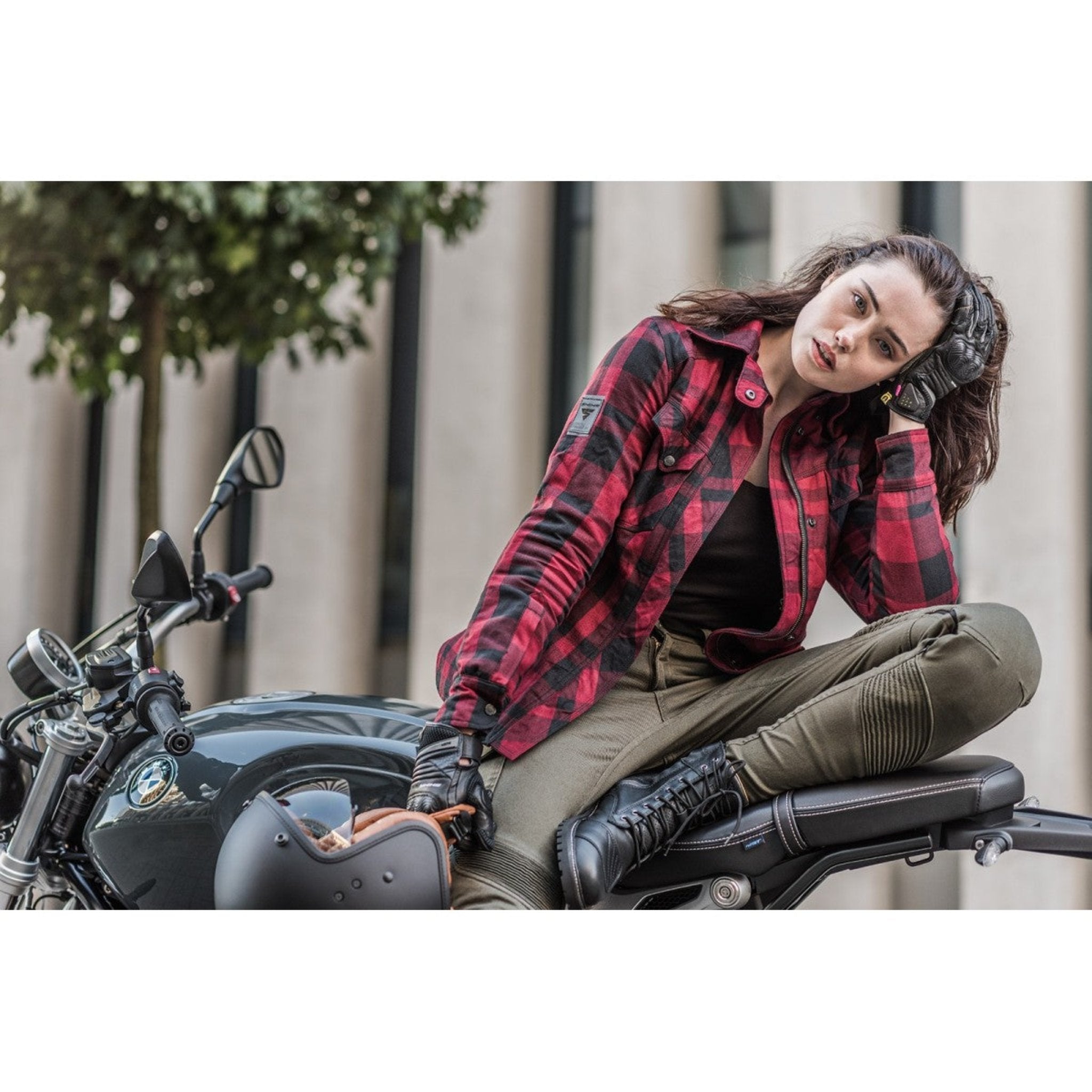 A women siting on a motorcycle and wearing Thomason black motorcycle boots from Shima